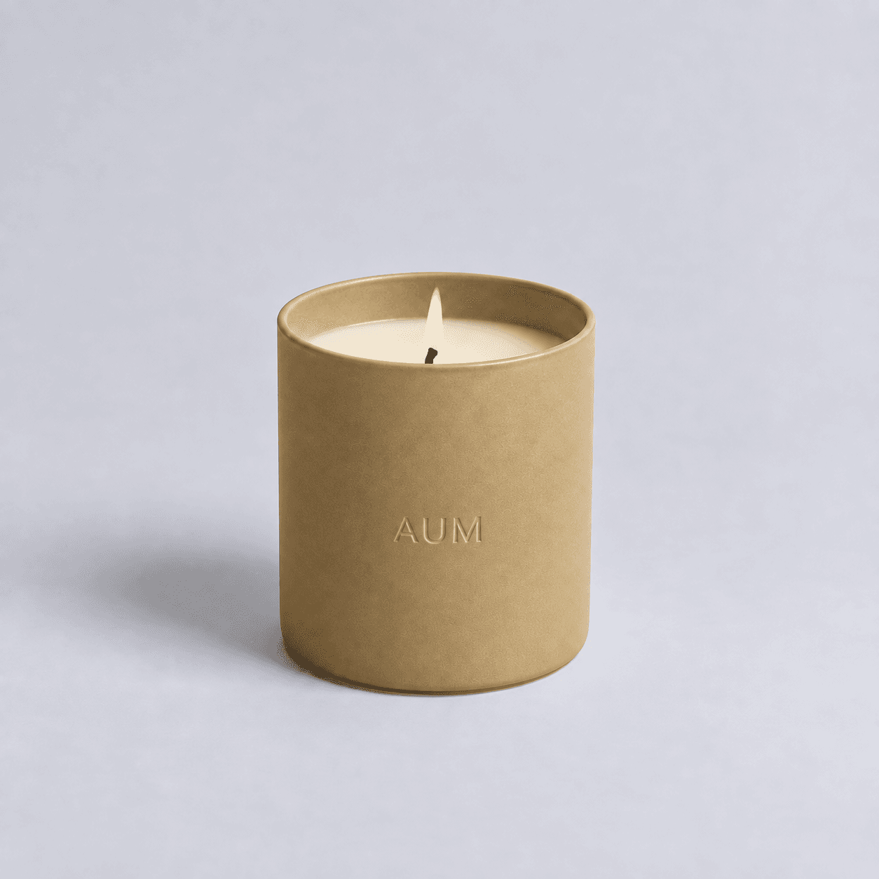 WONDER muted-gold ceramic candle